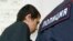 Russia -- Abror Azimov, a suspect over the recent bombing of a metro train in St. Petersburg, is escorted inside a court building in Moscow, April 18, 2017