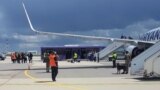 BELARUS -- Airport personnel and security forces are seen on the tarmac in front of a Ryanair flight which was forced to land in Minsk, May 23, 2021