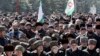 INGUSHETIA -- Local people hold Ingushetian region flags as they attend a rally to protest against a controversial border deal with neighboring Chechnya, in Nazran, March 26, 2019