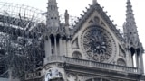 Firefighters work at Notre-Dame Cathedral in Paris