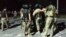 Policemen blocking the road to Koi Tash, August 8 2019