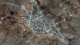 IRAQ -- A satellite view of the reported residence of ISIS leader, Abu Bakr al-Baghdadi, according to the source, near the village of Barisha, Syria, collected on September 28, 2019, is shown in this handout image released on October 27, 2019 by Maxar Tec