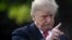(FILES) In this file photo taken on October 09, 2018, US President Donald Trump talks to the press as leaves the White House by the South lawn and boards Marine One en route to Council Bluffs, Iowa, for a 'Make America Great Again' rally in Washington DC.