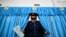 Kzakhstan -- A Kazakh policeman votes during parliamentary elections in the Kazakh city of Baikonur, also known as Russian-leased Baikonur cosmodrom, March 20, 2016