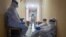 UKRAINE – Medical workers wait in a corridor at the Priboi health resort, Yevpatoria, Crimea, 29Oct2020