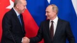 Moscow, Russia - Russian President Vladimir Putin and Turkish President Tayyip Erdogan shake hands during a news conference following their talks in Moscow, Russia March 5, 2020. 