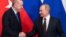 Moscow, Russia - Russian President Vladimir Putin and Turkish President Tayyip Erdogan shake hands during a news conference following their talks in Moscow, Russia March 5, 2020. 