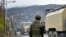 NAGORNO-KARABAKH -- Azerbaijani military trucks move through the town of Lachin, December 1, 2020