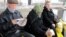 Turkmenistan. Elderly people sitting in bus stations. old weman, woman, man