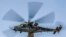 SYRIA -- A Russian military Mil Mi-24 "Hind" helicopter gunship flies during a joint Russian-Turkish patrol in the eastern countryside of the town of Darbasiyah near the border with Turkey in the northeastern Hasakah province, December 7, 2020