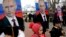 UKRAINE – Children hold portraits of Russian President Vladimir Putin as they take part in a rally to mark Defender of the Fatherland Day in the Crimean city of Sevastopol, February 23, 2016