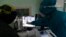 UKRAINE -- Medics wearing special suits to protect against coronavirus look at an X-ray of a patient's lungs at the city hospital in Striy, September 29, 2020
