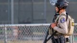 A police officer stands watch at the scene of a mass shooting during the Gilroy Garlic Festival in Gilroy, California, U.S. July 28, 2019. REUTERS/Chris Smead. NO ARCHIVES. NO RESALES.