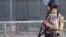 A police officer stands watch at the scene of a mass shooting during the Gilroy Garlic Festival in Gilroy, California, U.S. July 28, 2019.  REUTERS/Chris Smead. NO ARCHIVES. NO RESALES.