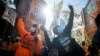 Philadelphia, Pennsylvania, U.S. - Activists dance in celebration after Democratic presidential nominee Joe Biden overtook President Donald Trump in the Pennsylvania general election vote count across the street from where ballots are being counted, three