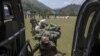 Nepal, Nepal military personnel run towards an Indian Army helicopter as they take part in earthquake relief operations at Gorkha, Nepal, May 2, 2015