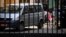 RUSSIA -- A girl stands among diplomatic cars as Czech diplomats prepare to leave the grounds of the country's embassy in Moscow, April 19, 2021