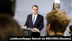 Премьер-министр Финляндии Юха Сипиля во время пресс-конференции 8 марта 2019 года