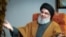 (FILES) A file handout picture obtained by AFP from the office of Iran's Supreme Leader Ayatollah Ali Khamenei on September 28, 2019, shows Lebanon's Hezbollah leader Hassan Nasrallah during what the office said was an "exclusive discussion" with members 