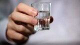 Generic – Man hand with glass of vodka 