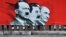 Ukraine -- A placard depicting Adolf Hitler (L), Joseph Stalin (C) and Russian President Vladimir Putin displayed on the Maidan camp on Independence Square in Kyiv, July 28, 2014