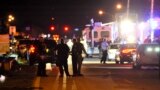 USA – Florida Shooting Aftermath Police vehicles block the road to Marjory Stoneman Douglas High School