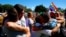 People celebrate after it was announced the majority of Australians support same-sex marriage