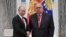 Russia -- Russian President Vladimir Putin (L) shakes hands with Russian businessman and founder of USM Holdings Alisher Usmanov during an awarding ceremony at the Kremlin in Moscow, November 27, 2018