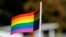 KOSOVO -- A participant vawe rainbow flags during Kosovo's first-ever LGBT pride parade held in Pristina, October 10, 2017