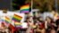 KOSOVO -- A participant vawe rainbow flags during Kosovo's first-ever LGBT pride parade held in Pristina, October 10, 2017