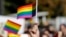KOSOVO -- A participant vawe rainbow flags during Kosovo's first-ever LGBT pride parade held in Pristina, October 10, 2017