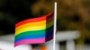 KOSOVO -- A participant vawe rainbow flags during Kosovo's first-ever LGBT pride parade held in Pristina, October 10, 2017