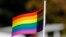 KOSOVO -- A participant vawe rainbow flags during Kosovo's first-ever LGBT pride parade held in Pristina, October 10, 2017