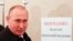 Russia -- Russian President Vladimir Putin visits a polling station during parliamentary elections in Moscow, September 18, 2016