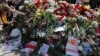 Belarus -- People place flowers at a makeshift memorial as they pay tribute to protester Alexander Taraykovskiy, who was killed during recent rallies against the presidential election results, at the site of his death in Minsk, Belarus August 15, 2020