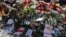 Belarus -- People place flowers at a makeshift memorial as they pay tribute to protester Alexander Taraykovskiy, who was killed during recent rallies against the presidential election results, at the site of his death in Minsk, Belarus August 15, 2020