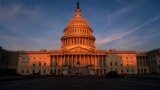 U.S. -- The rising sun divides the West Front of the U.S. Capitol in Washington, September 25, 2019