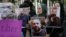 GEORGIA -- People hold portraits of Zelimkhan Khangoshvili in front of the German embassy in Tbilisi, September 10, 2019