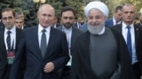 ARMENIA -- Russian President Vladimir Putin and Iranian President Hassan Rouhani arrive for a meeting on the sidelines of a session of the Supreme Eurasian Economic Council In Yerevan, Armenia October 1, 2019.