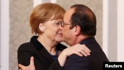 Канцлер Германии и президент Франции после переговоров. 12 февраля 2015