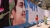Afghanistan -- Murals painted over in first days of Taliban rule. 