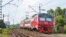 DOLGOPRUDNY, MOSCOW REGION, RUSSIA - JULY 15, 2016: The electric train ED4M DC-0456 approaching a railway crossing