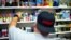 A vape shop worker organizes electronic smoking products in a local store in Jersey City, New Jersey, U.S.,  September 12, 2019.   REUTERS/Eduardo Munoz - RC16B878B5F0