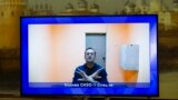 RUSSIA -- Russian opposition leader Aleksei Navalny appears on a TV screen during a live session with the court during a hearing of his appeal in a court in Moscow, January 28, 2021