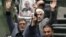IRAN -- Iranian lawmakers holding pictures of slain Iran's Quds Force leader Qasem Soleimani as they chant 'death to America', during a parliament session in Tehran, January 7, 2020