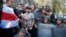 UKRAINE -- Foreign volunteers chain themselves to a fence during a protest of Ukrainian activists in front of the Presidential office in Kyiv, September 20, 2018