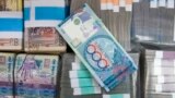 Kazkhstan -- Tenge currency notes are seen in a Kazkommertsbank branch in Almaty, February 4, 2010