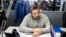 RUSSIA -- In this Thursday, Oct. 6, 2016 file photo, Roman Badanin, chief editor of the Proekt investigative online outlet sits at a working lace in Moscow, Russia. 