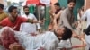 Не менее 89 человек погибли в двух взрывах во время предвыборного шествия в Пакистане