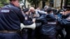 RUSSIA -- Police officers block protesters at a rally against alleged violations ahead of elections to Moscow City Duma, the capital's regional parliament, in Moscow, July 14, 2019